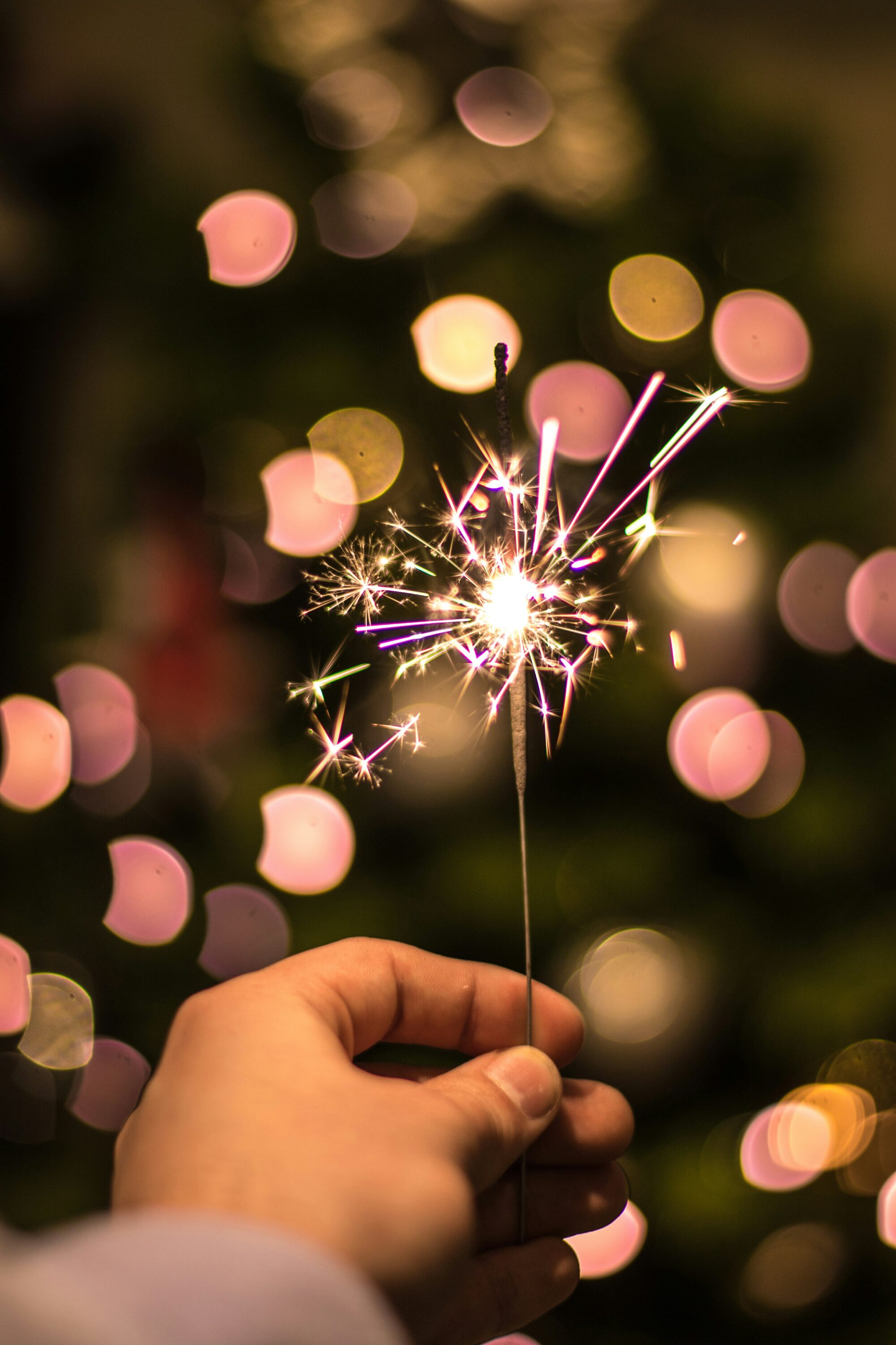 person holding a sparkler representing ideas sparking