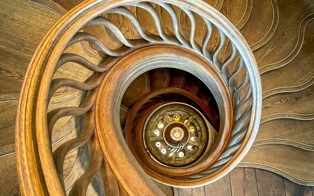 Image shows looking down onto a spiral staircase.